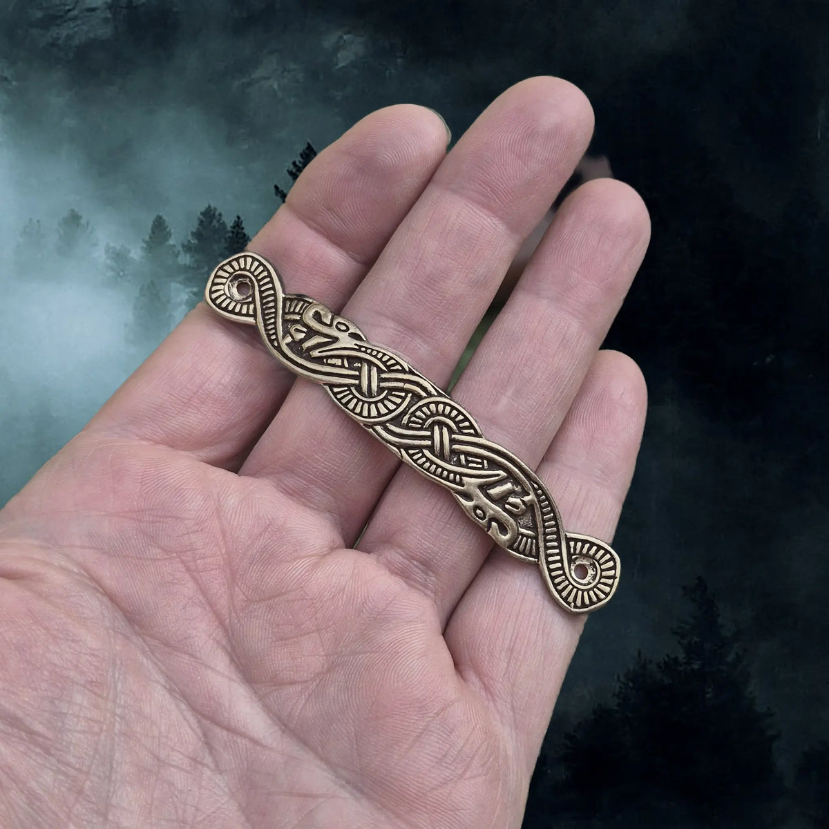 Viking Style Bronze Scabbard Bridge Mount with Serpent Design on hand