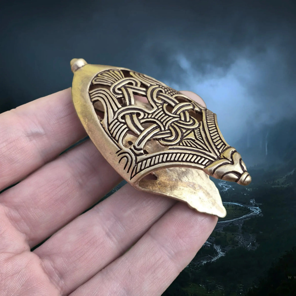 Bronze Replica Viking Scabbard Chape Replica from Skåne, Sweden in Borre Style on Hand - Angle View