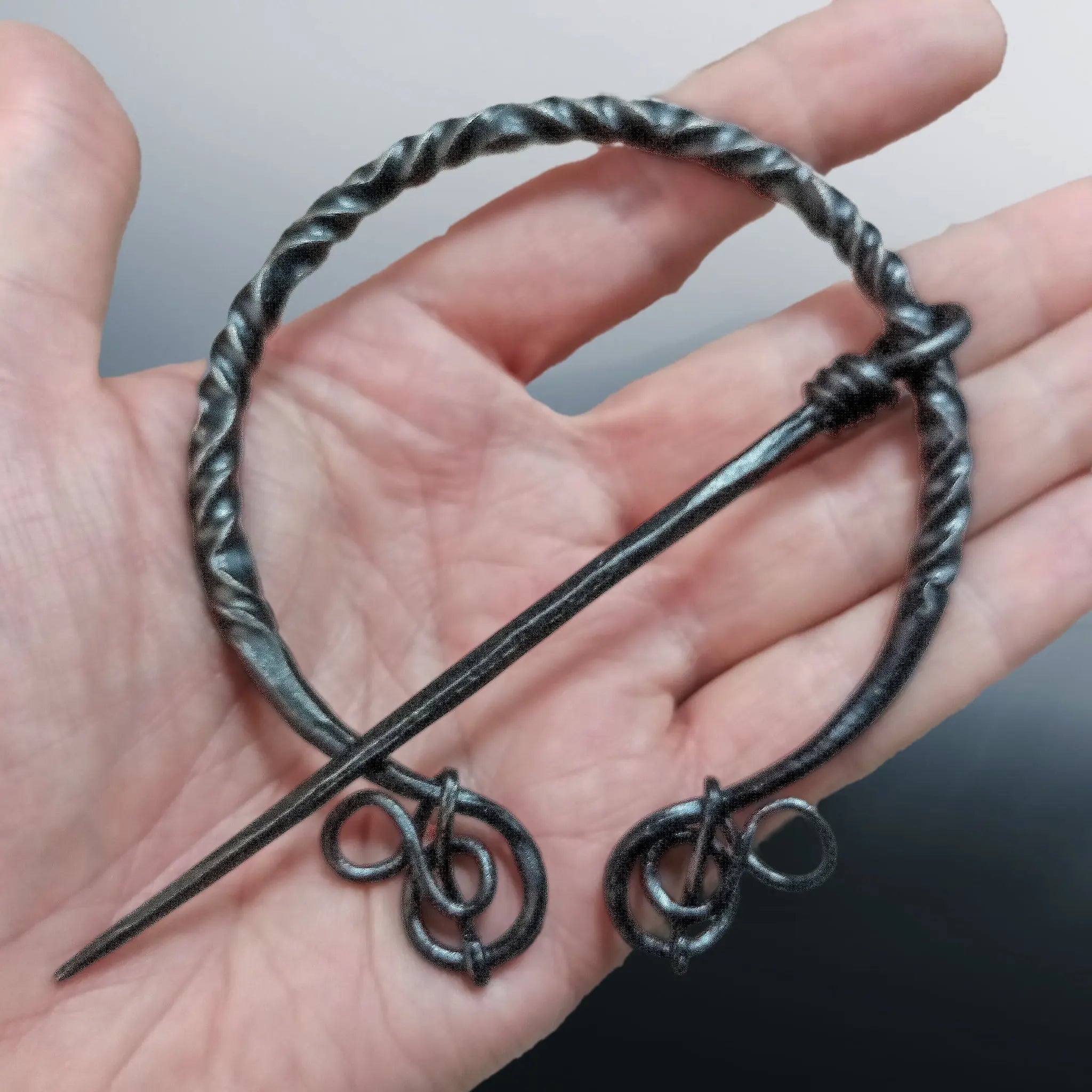 Large Decorated Iron Viking Cloak Pin from Birka in Hand