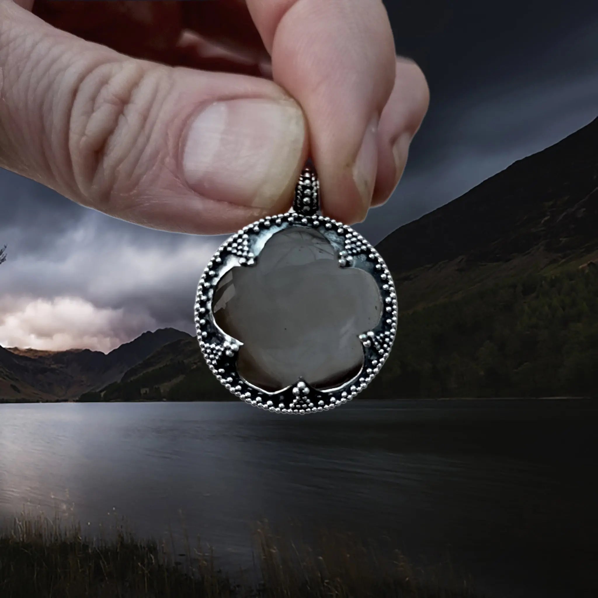 Large Silver Gotland Crystal Lens Pendant in Fingers