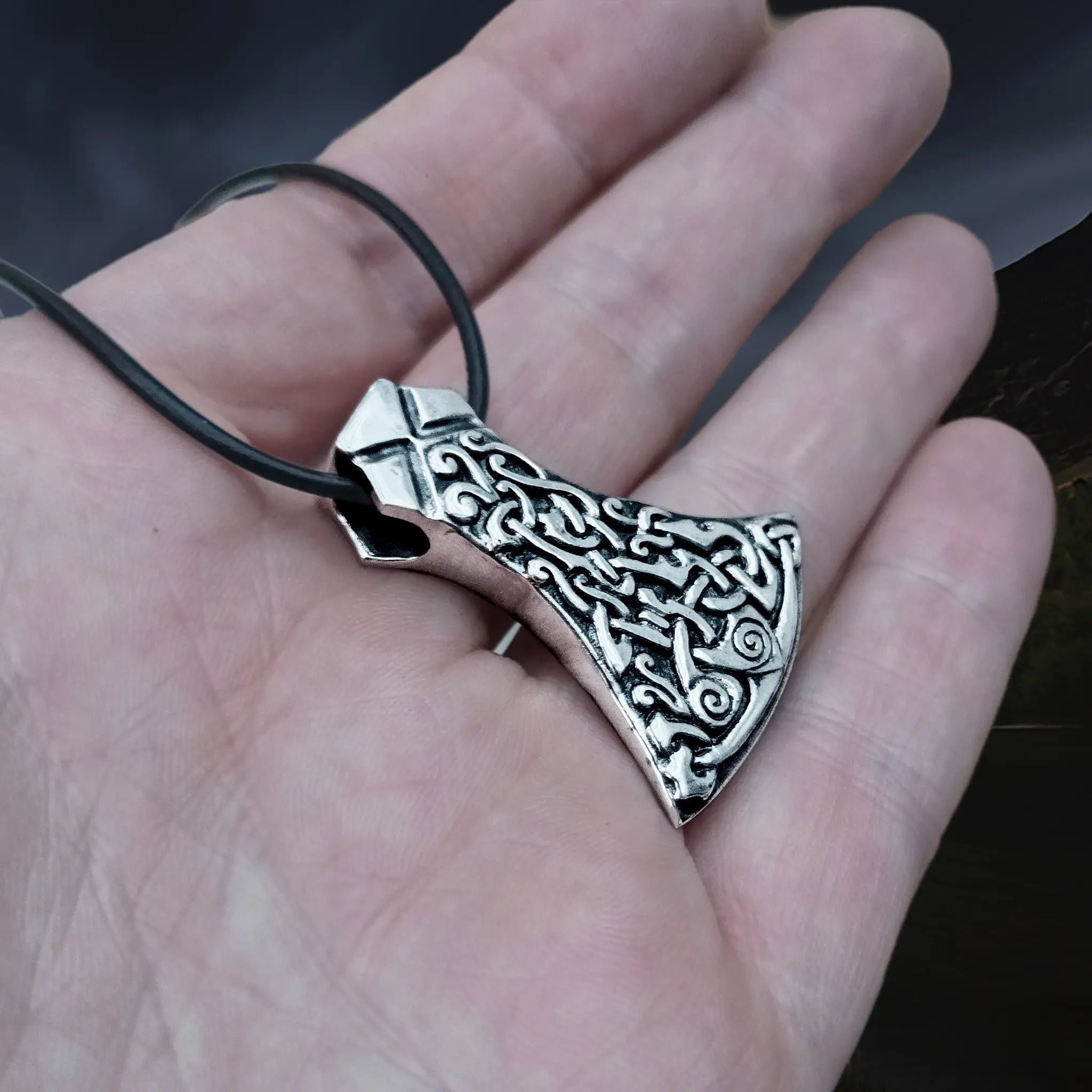 Silver Mammen Axe Head Viking Pendant on Leather Thong on Hand - Angle View