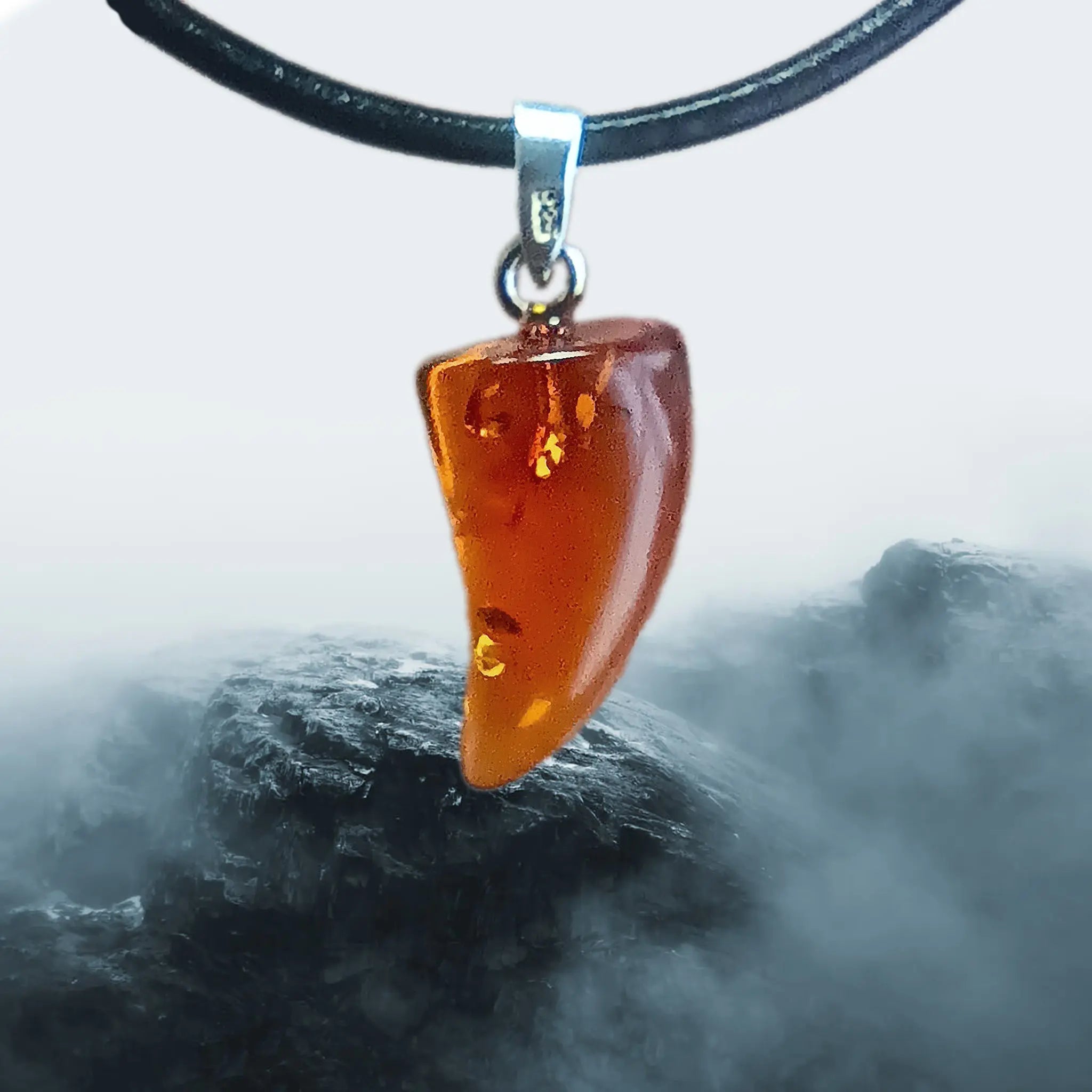 Hand-Cut &amp; Polished Amber Pendant, Shaped into a Wolf's / Dragon's Tooth with Sterling Silver Hanger on Lather Cord