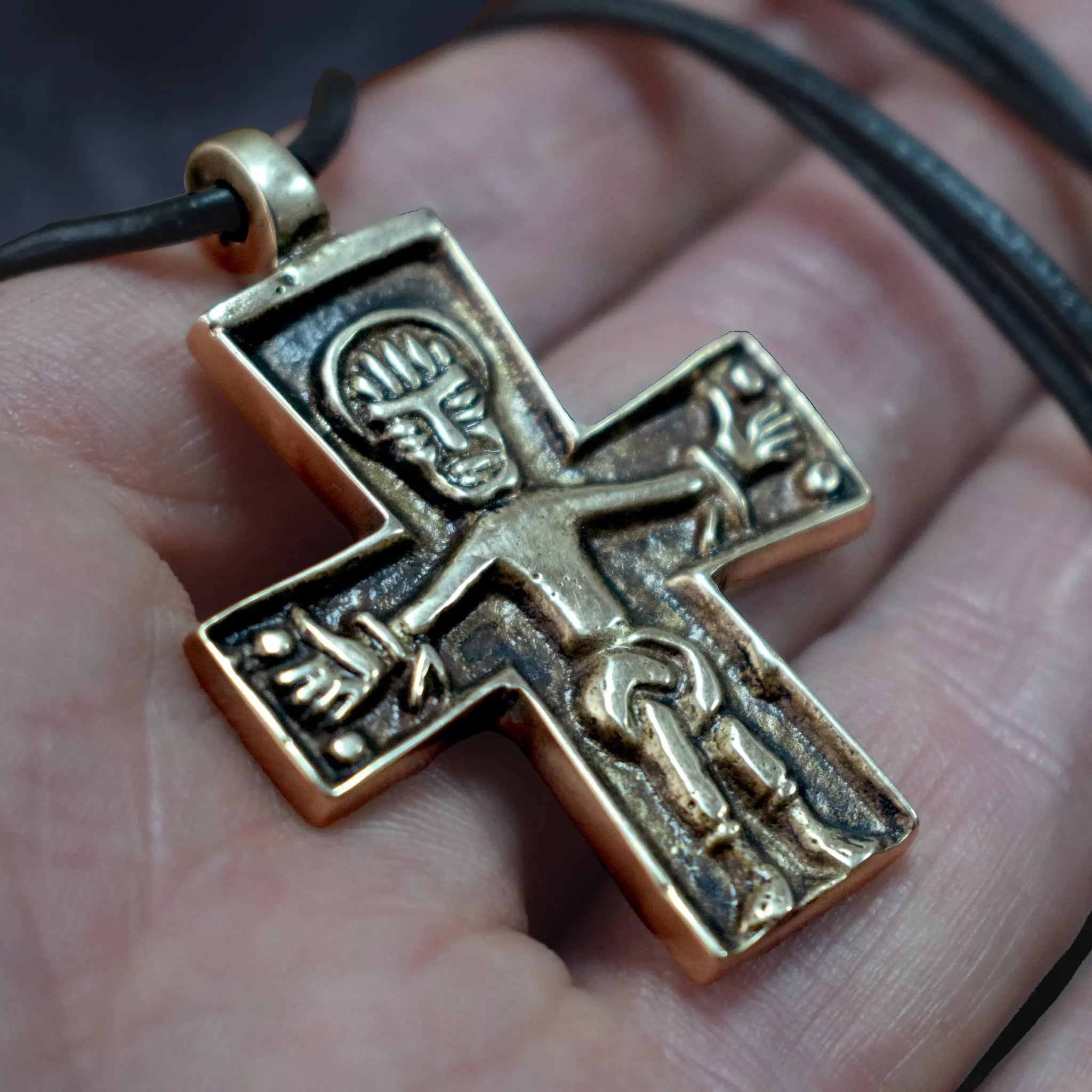 Bronze Replica Germanic Cross / Crucifix Pendant on Leather Cord -  On Hand - Close Up Angle View
