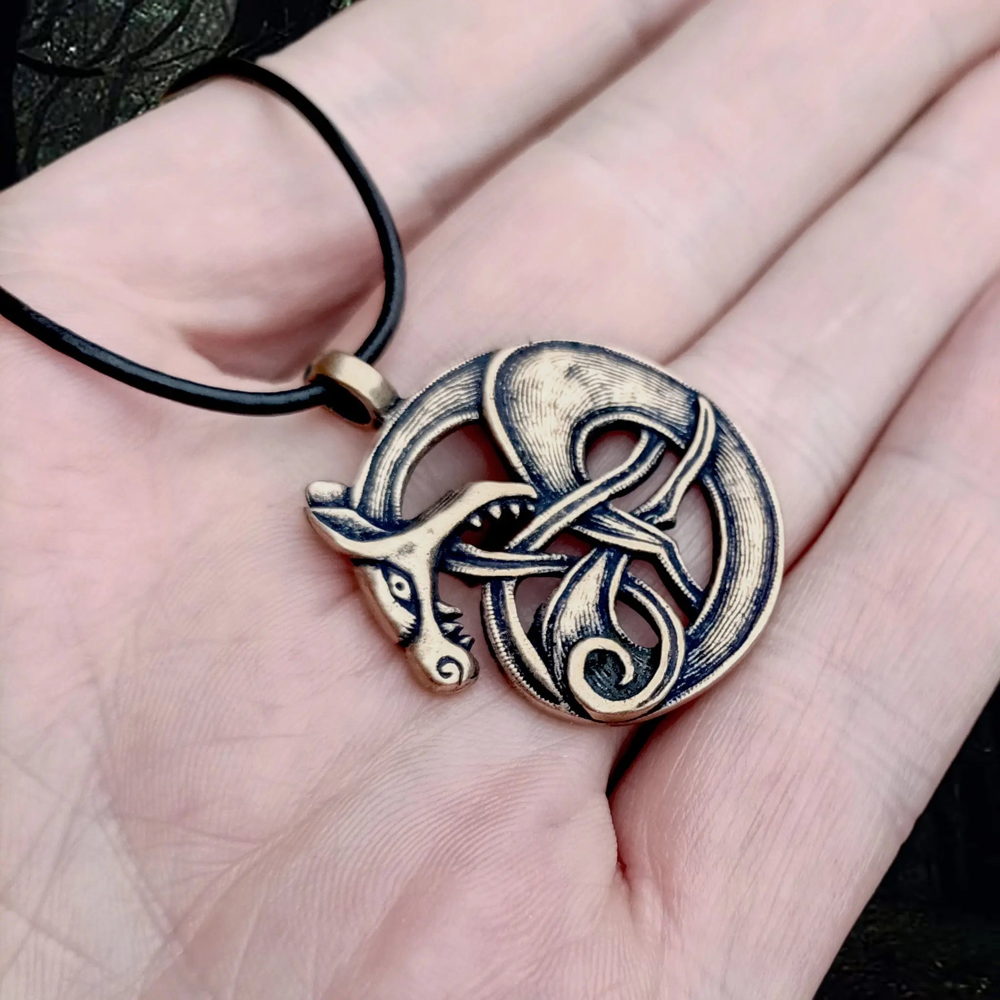 Bronze Fenrir Viking Wolf Pendant on Hand - Angle View - Viking Jewelry