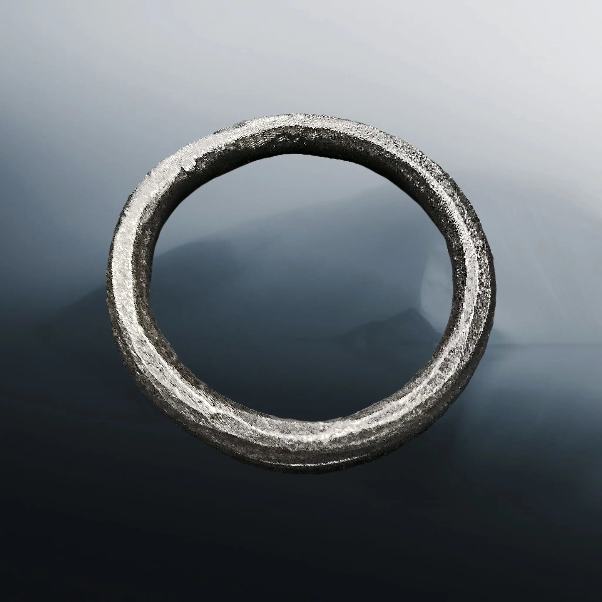 Hand-Forged Large Iron O Ring on Misty Iceberg Background
